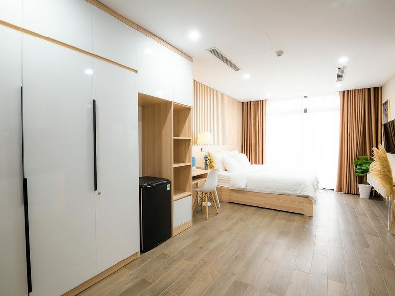 Modern clean desk with a single plant and soft light